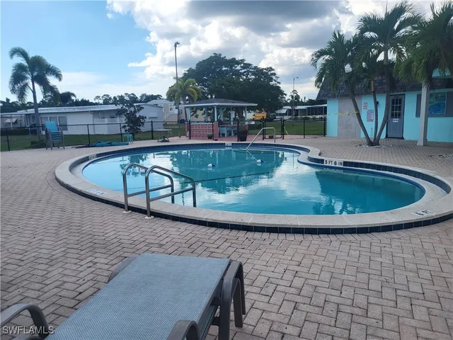 a view of a swimming pool with a patio