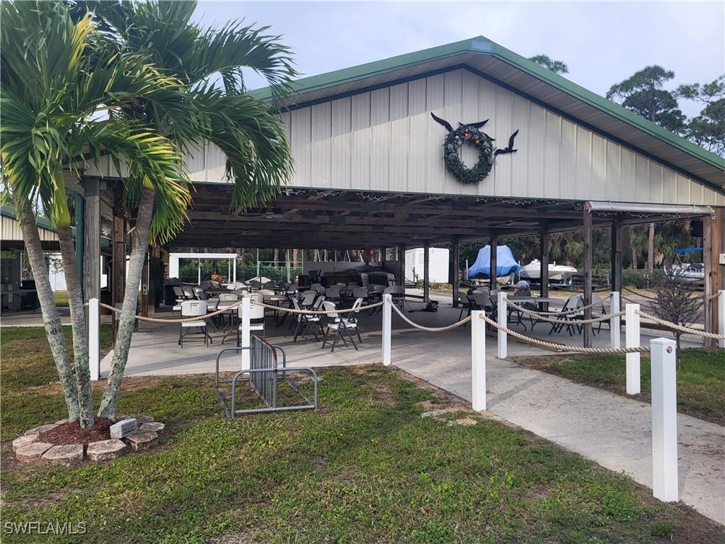 87 Middlesex Road Fort Myers, FL 33908 - Photo 3 of 7 a view of a chairs and tables in a patio