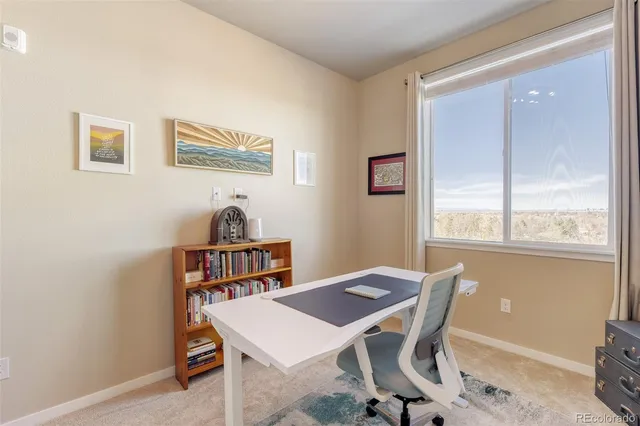 a view of a dining room with furniture window and outside view
