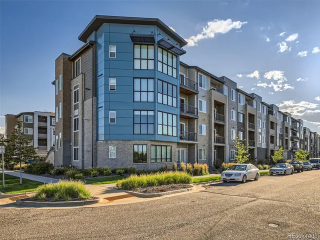 a view of a brick house with a door and a window
