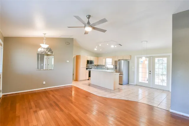 a view of a kitchen counter space and wooden floor