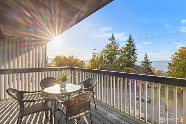 a view balcony with a table and chairs