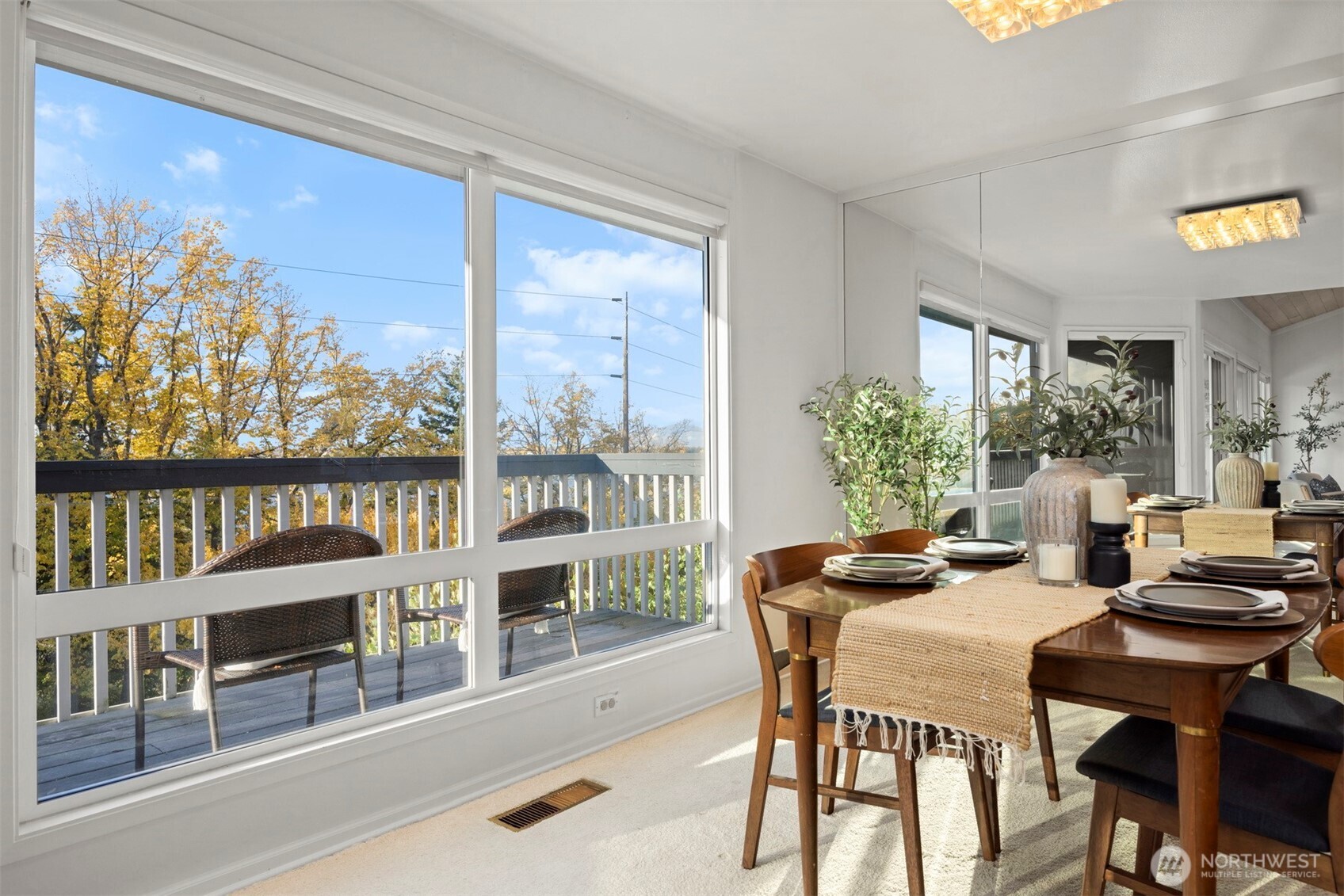 337 South State Street, Unit 2 Bellingham, WA 98225 - Photo 14 of 40 a dining room with furniture a rug and a floor to ceiling window