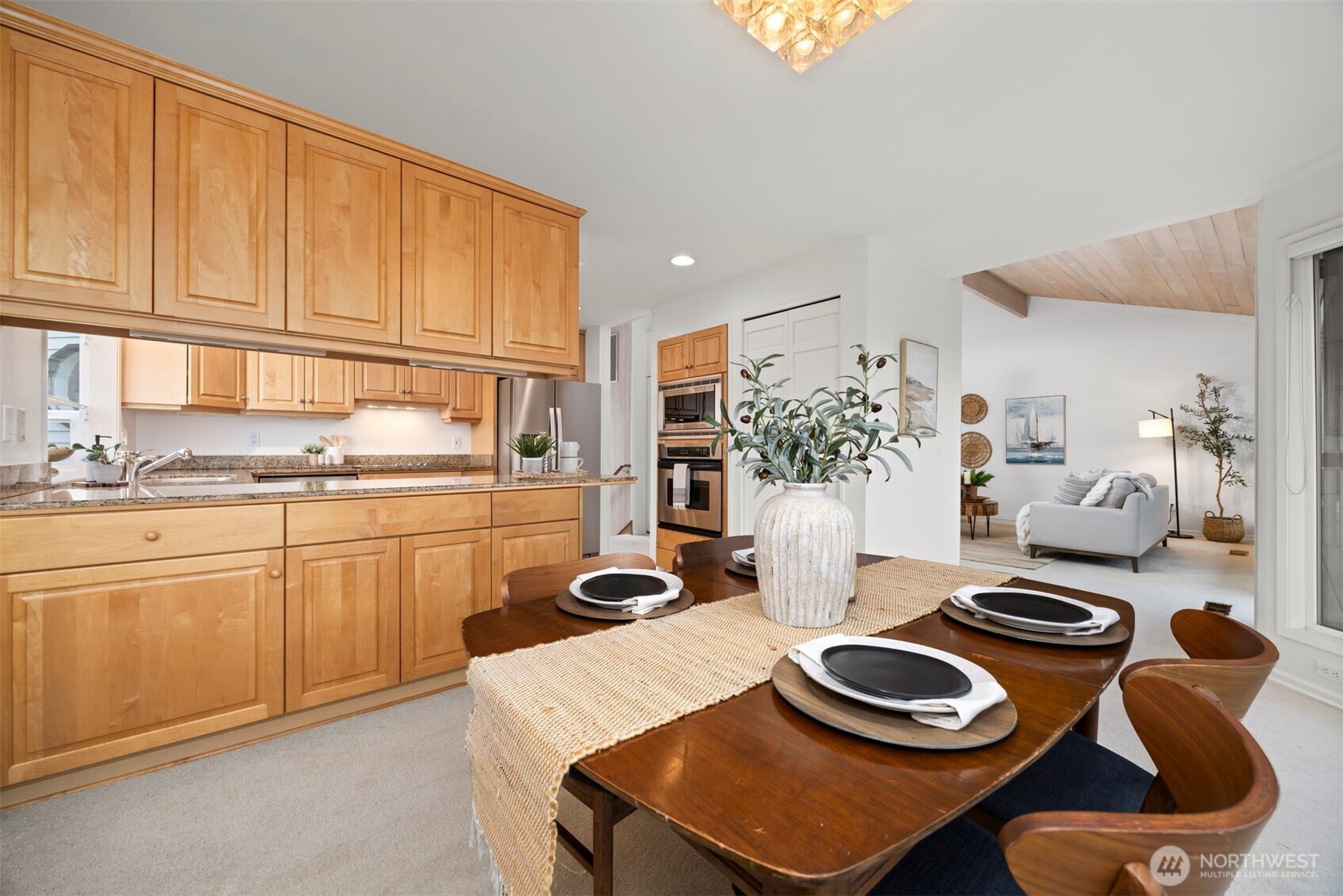 337 South State Street, Unit 2 Bellingham, WA 98225 - Photo 15 of 40 a kitchen with a table and chairs in it