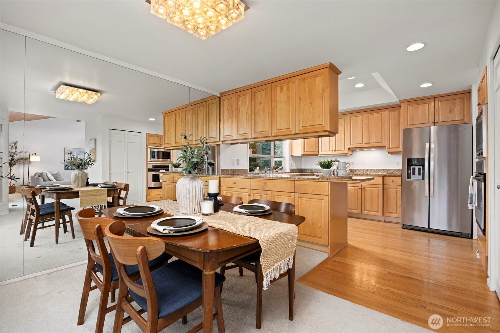 337 South State Street, Unit 2 Bellingham, WA 98225 - Photo 16 of 40 a kitchen with a dining table chairs and refrigerator