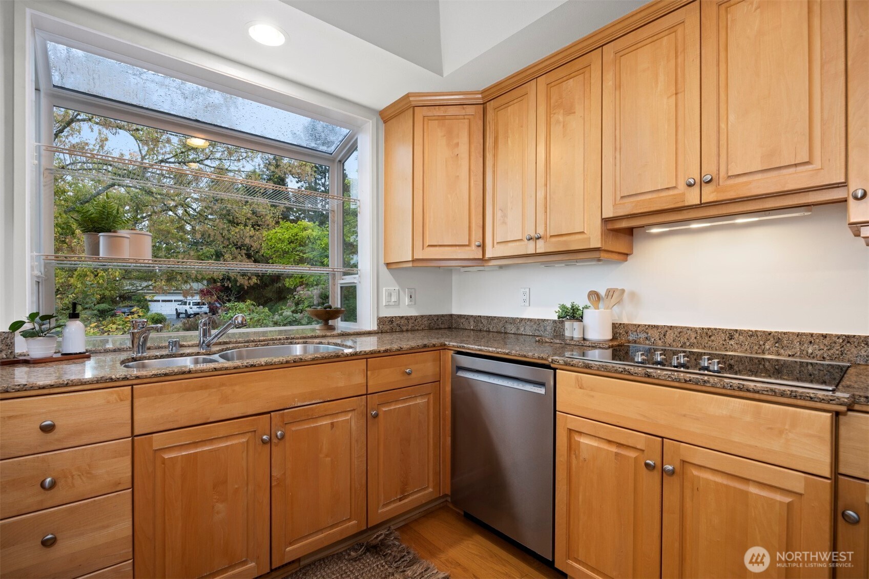 337 South State Street, Unit 2 Bellingham, WA 98225 - Photo 18 of 40 a kitchen with stainless steel appliances granite countertop a sink a stove and cabinets