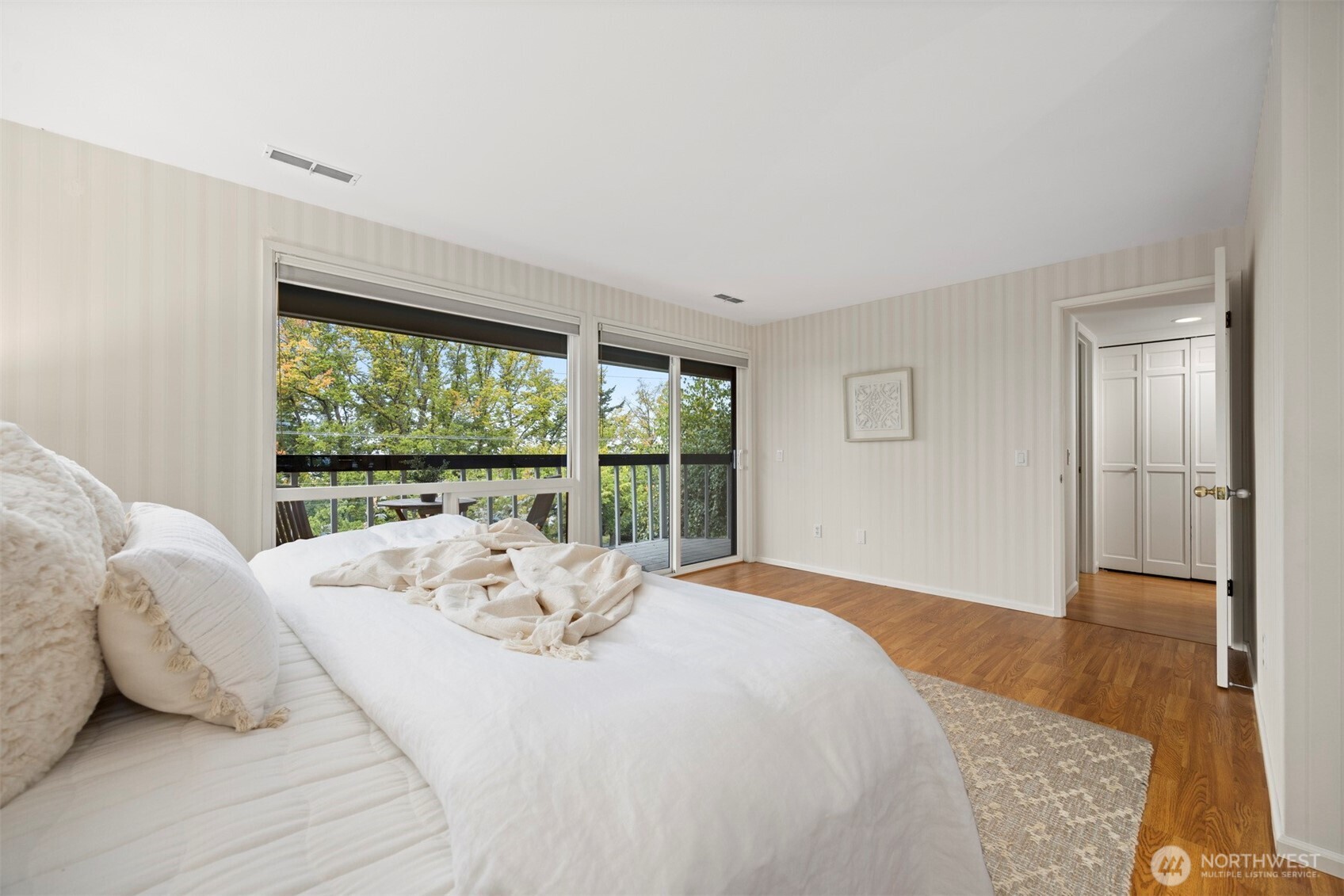 337 South State Street, Unit 2 Bellingham, WA 98225 - Photo 20 of 40 a view of a bedroom with a bed and wooden floor