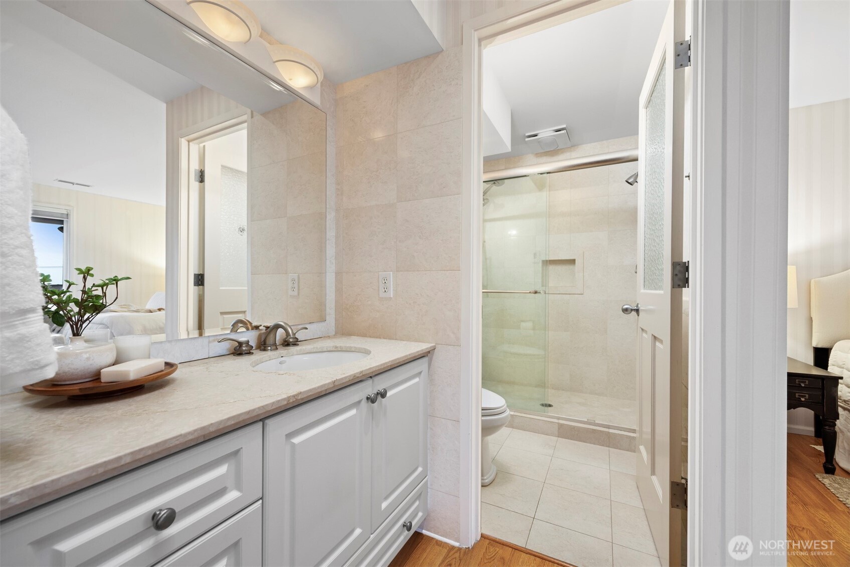 337 South State Street, Unit 2 Bellingham, WA 98225 - Photo 22 of 40 a bathroom with a granite countertop sink a toilet and shower