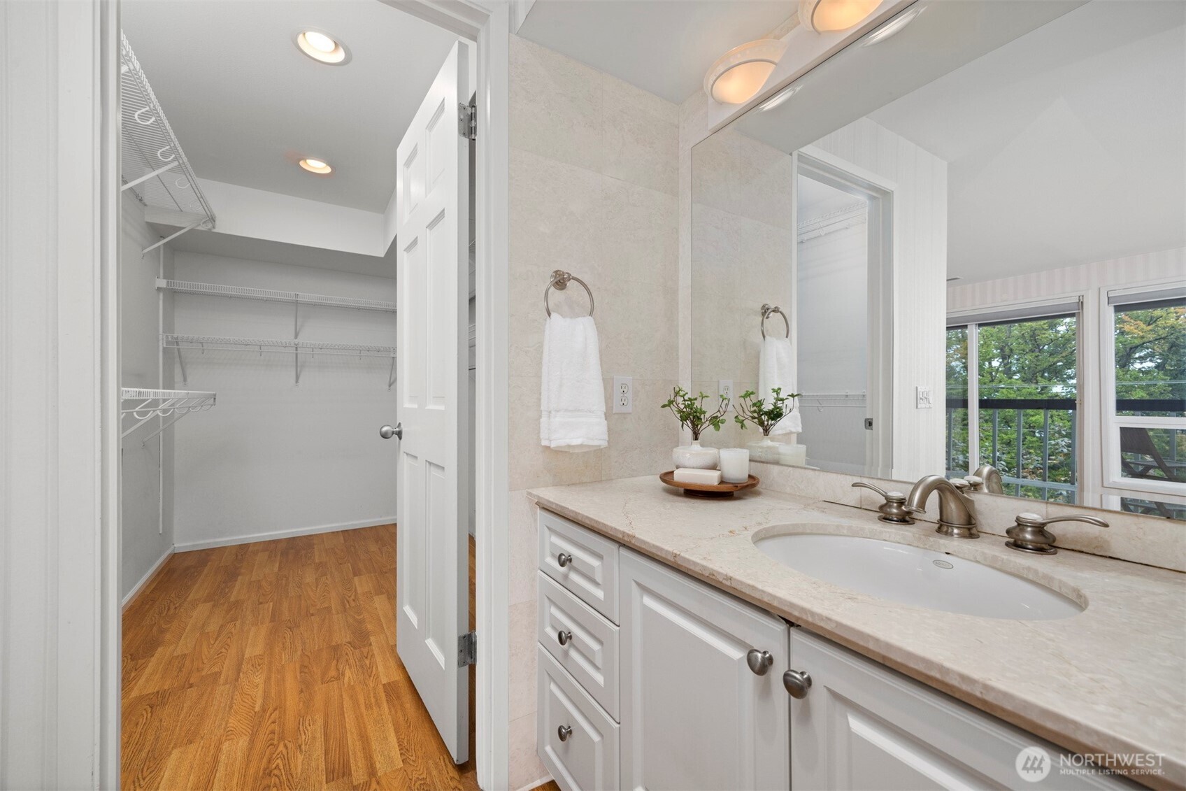 337 South State Street, Unit 2 Bellingham, WA 98225 - Photo 24 of 40 a bathroom with a granite countertop sink and a mirror