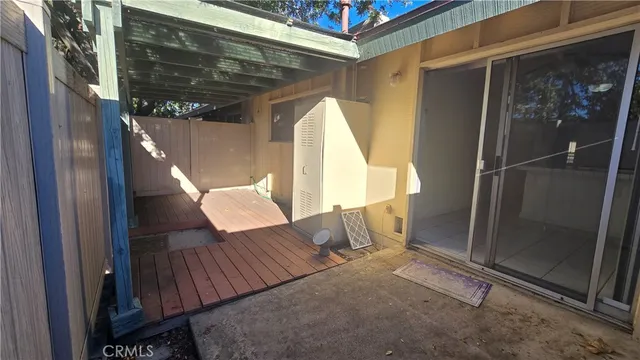 a view of balcony with wooden floor