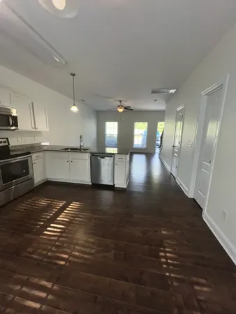 a view of a kitchen and a window