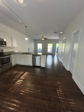 a view of a kitchen and a window