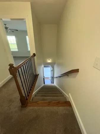 a view of a hallway with staircase