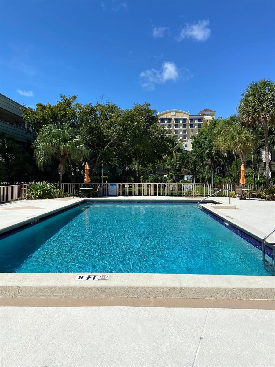 8335 Southwest 72nd Avenue, Unit 202D Miami, FL 33143 - Photo 17 of 24 a view of a yard