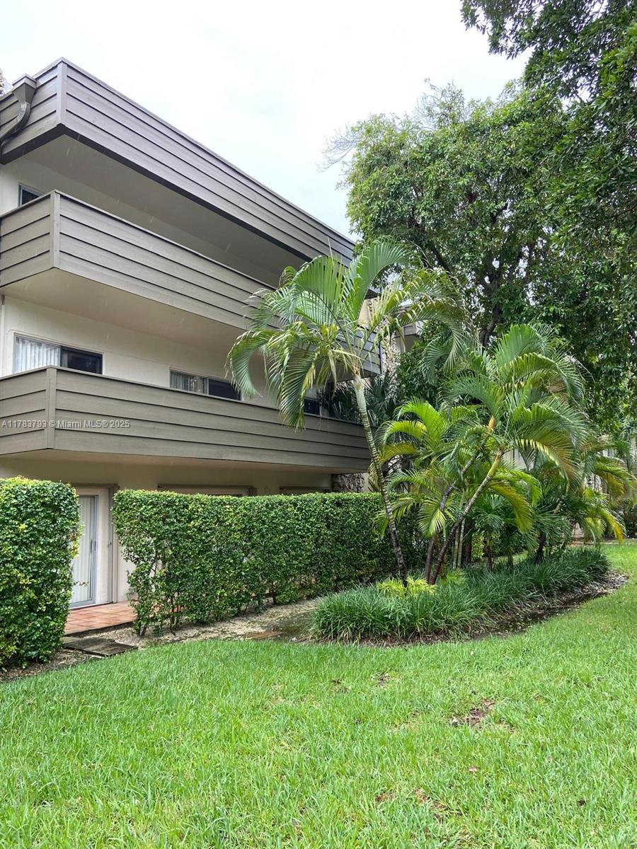 8335 Southwest 72nd Avenue, Unit 202D Miami, FL 33143 - Photo 23 of 24 a view of a house with a backyard