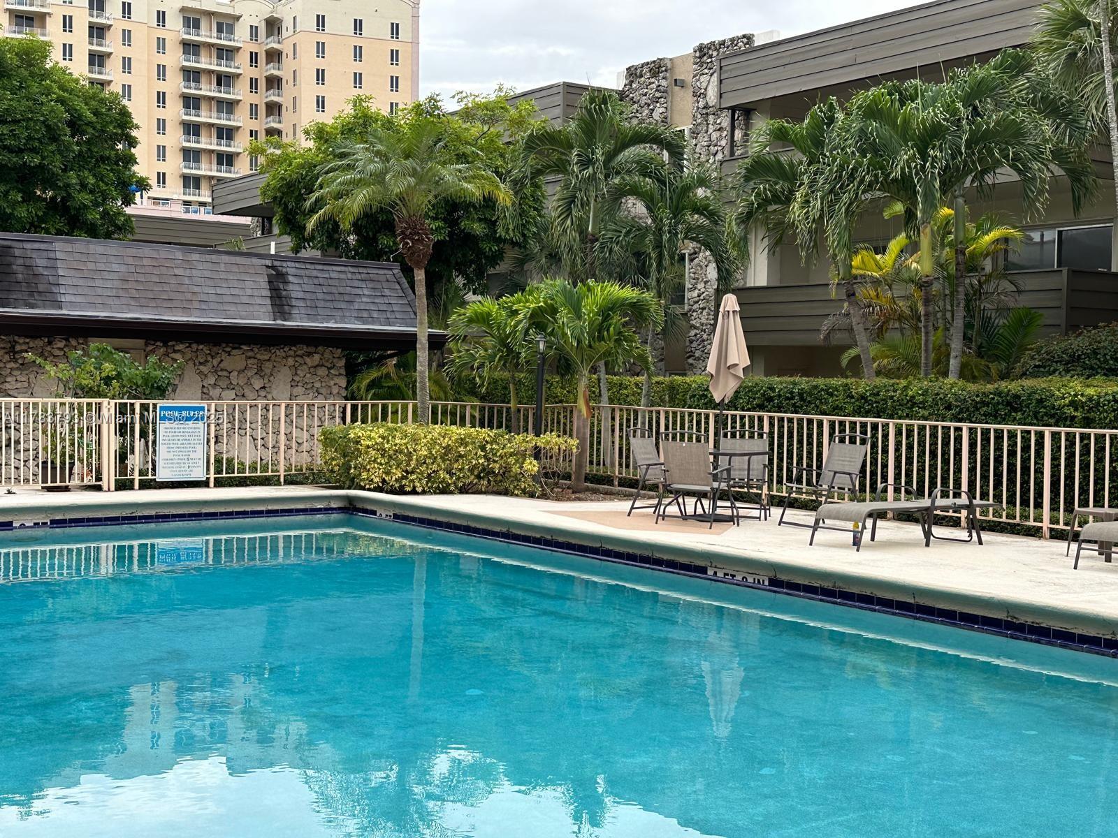 8335 Southwest 72nd Avenue, Unit 202D Miami, FL 33143 - Photo 5 of 24 a view of a house with a backyard