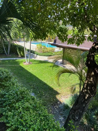 a view of backyard and porch