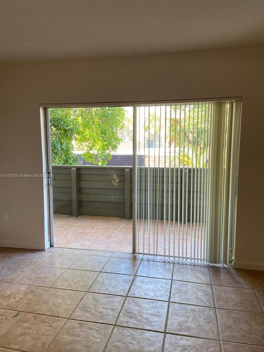 8335 Southwest 72nd Avenue, Unit 202D Miami, FL 33143 - Photo 7 of 24 a view of backyard and porch