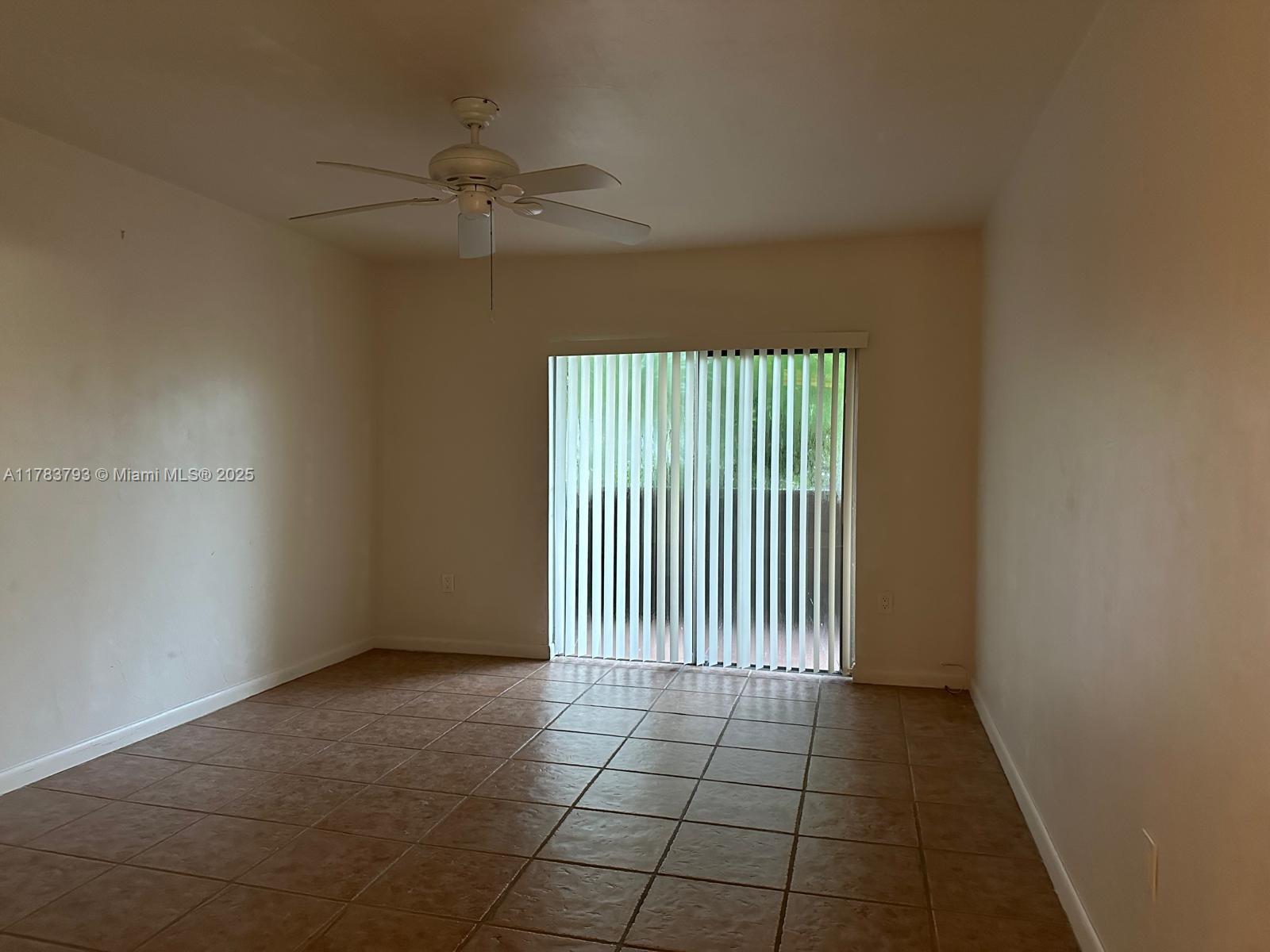 8335 Southwest 72nd Avenue, Unit 202D Miami, FL 33143 - Photo 10 of 24 an empty room with windows