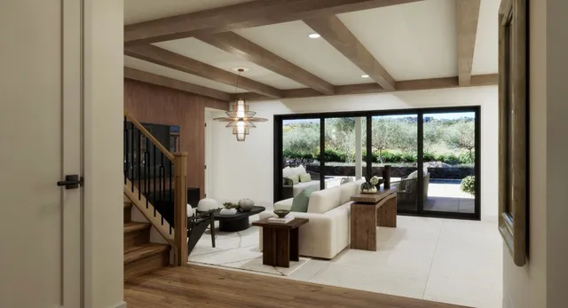 a living room with furniture large window and outer view