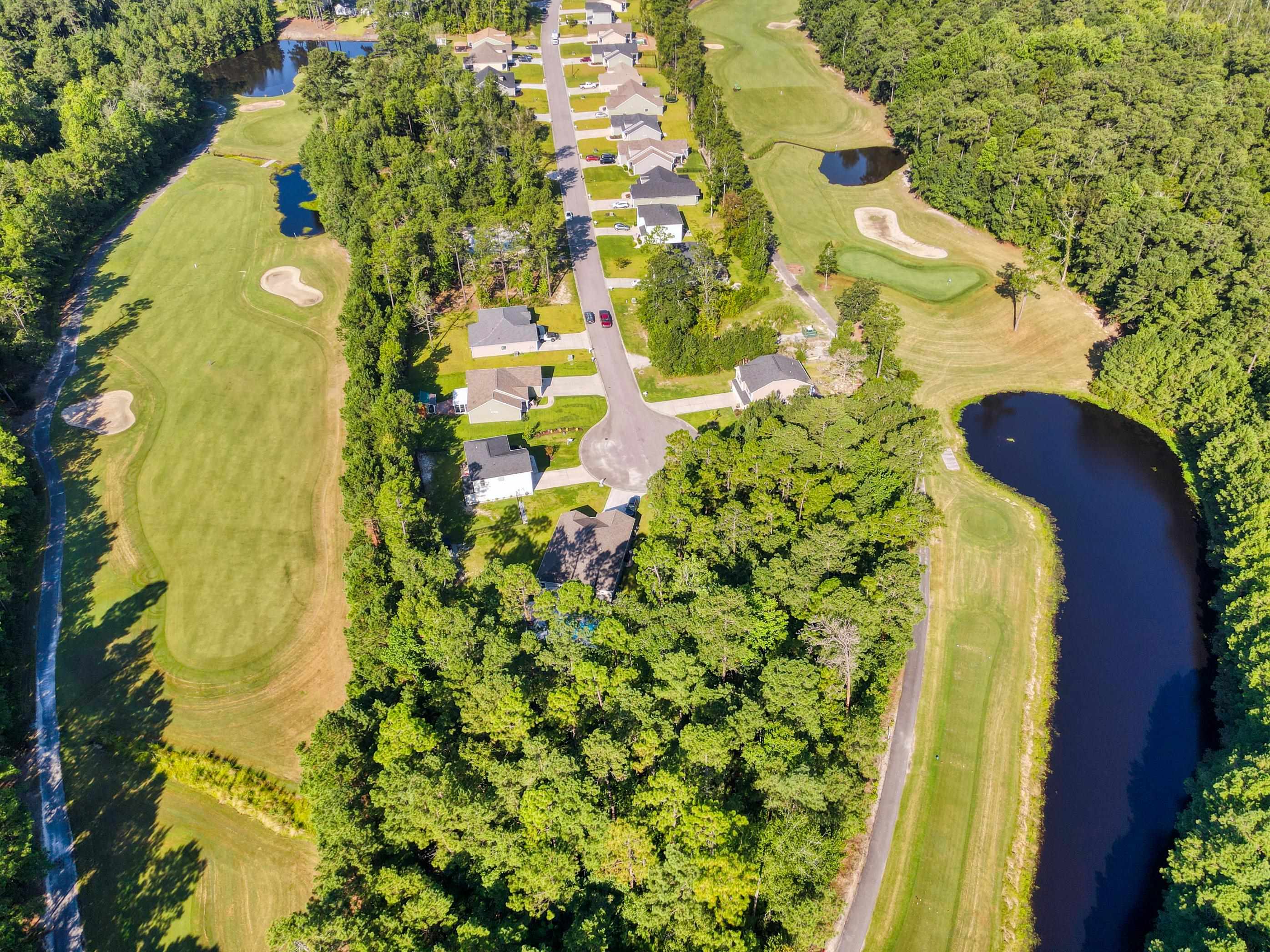 677 Timber Creek Drive Loris, SC 29569 - Photo 25 of 33 Aerial view of property's location featuring a large body of water