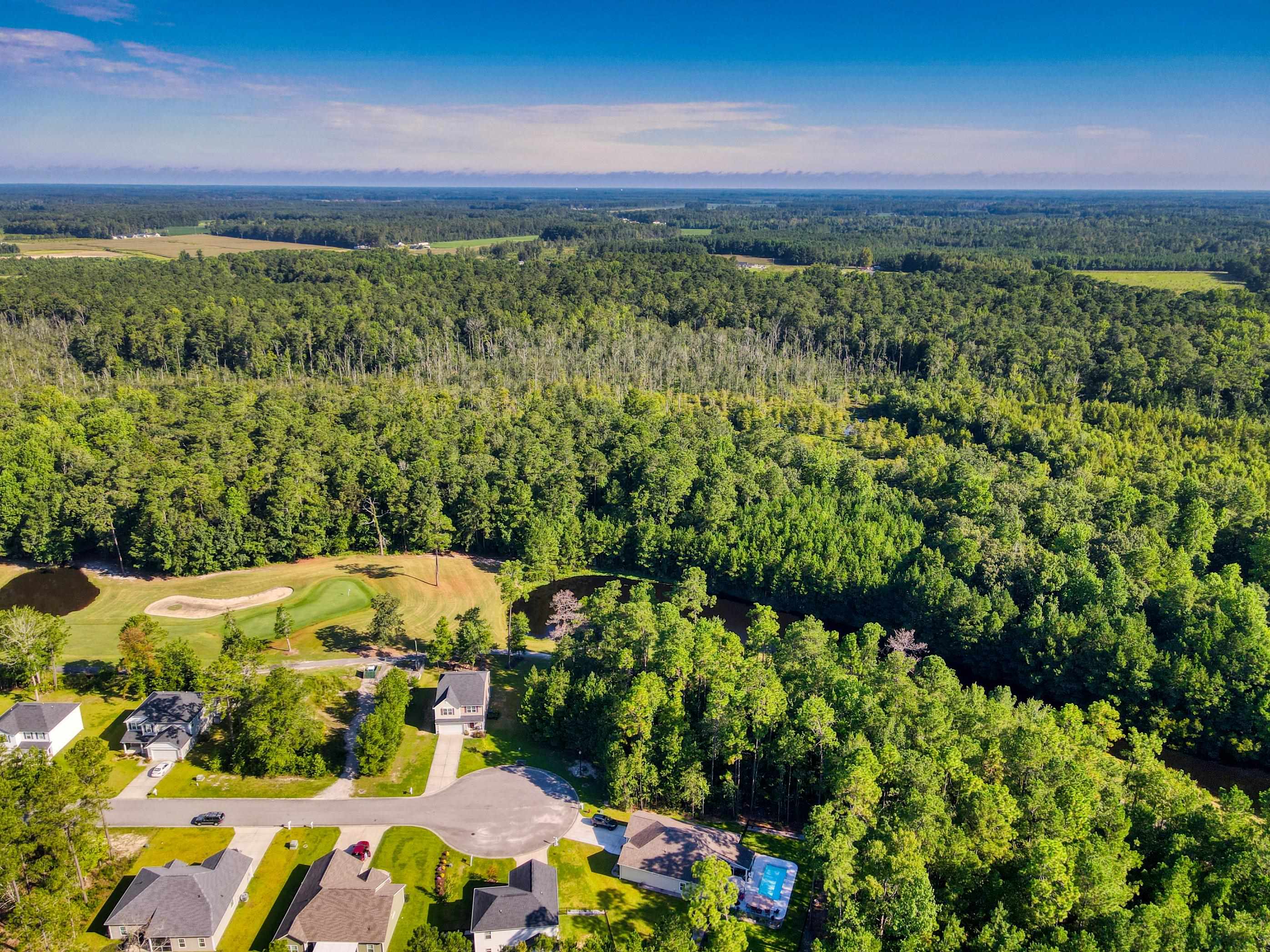 677 Timber Creek Drive Loris, SC 29569 - Photo 26 of 33 View of property location with nearby suburban area, a local golf course, and a large body of water