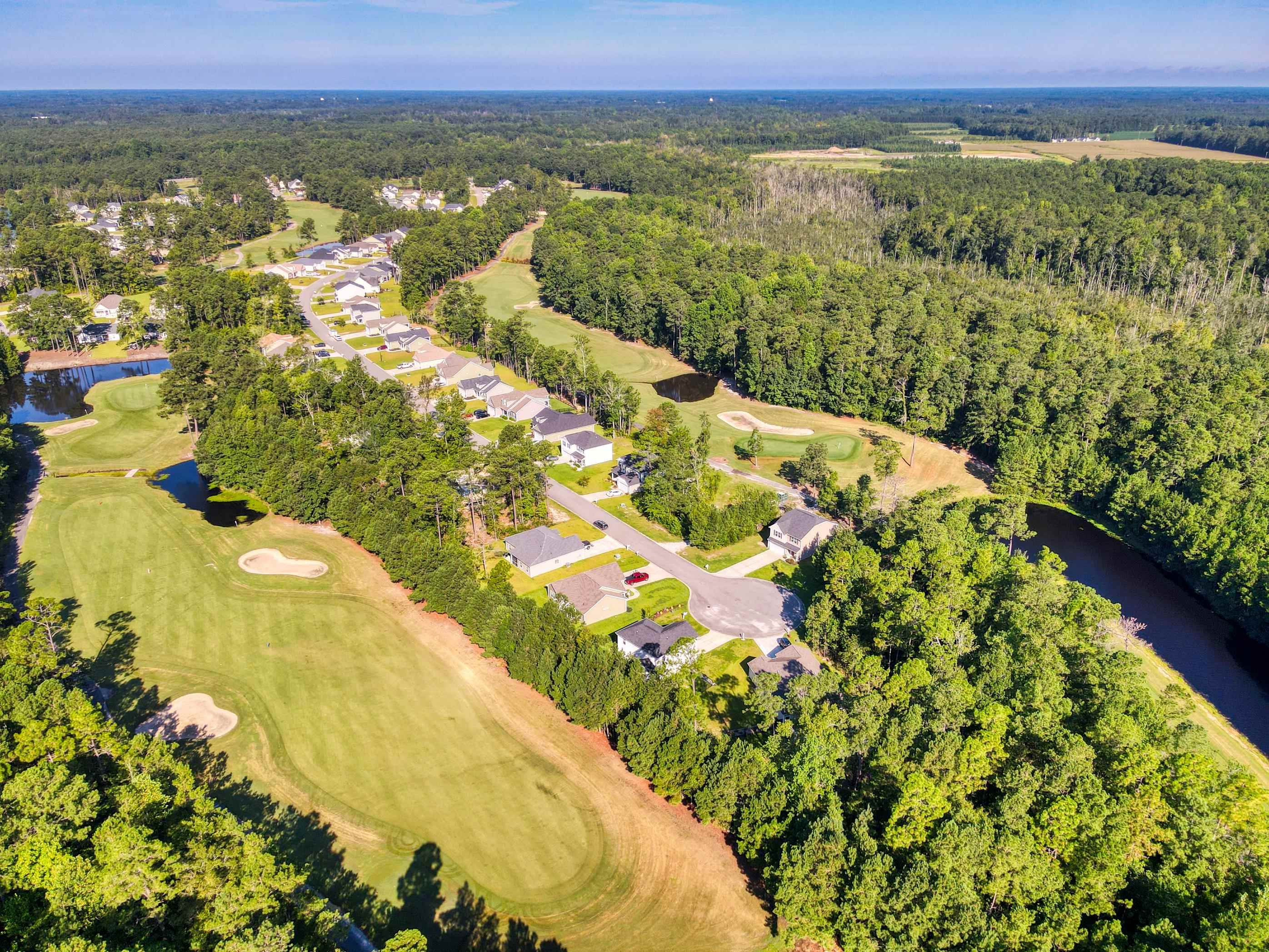 677 Timber Creek Drive Loris, SC 29569 - Photo 30 of 33 Aerial overview of property's location with a large body of water