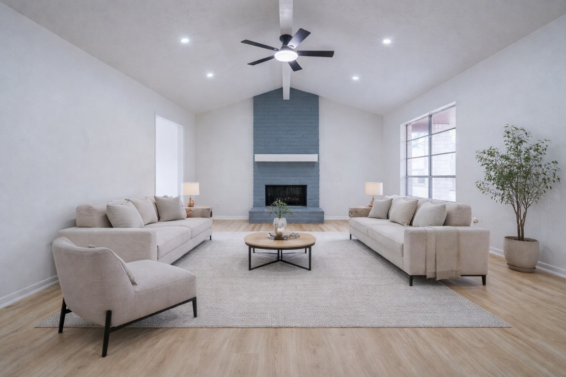 23230 Briarcreek Boulevard Spring, TX 77373 - Photo 1 of 32 a living room with furniture a chandelier and a fireplace