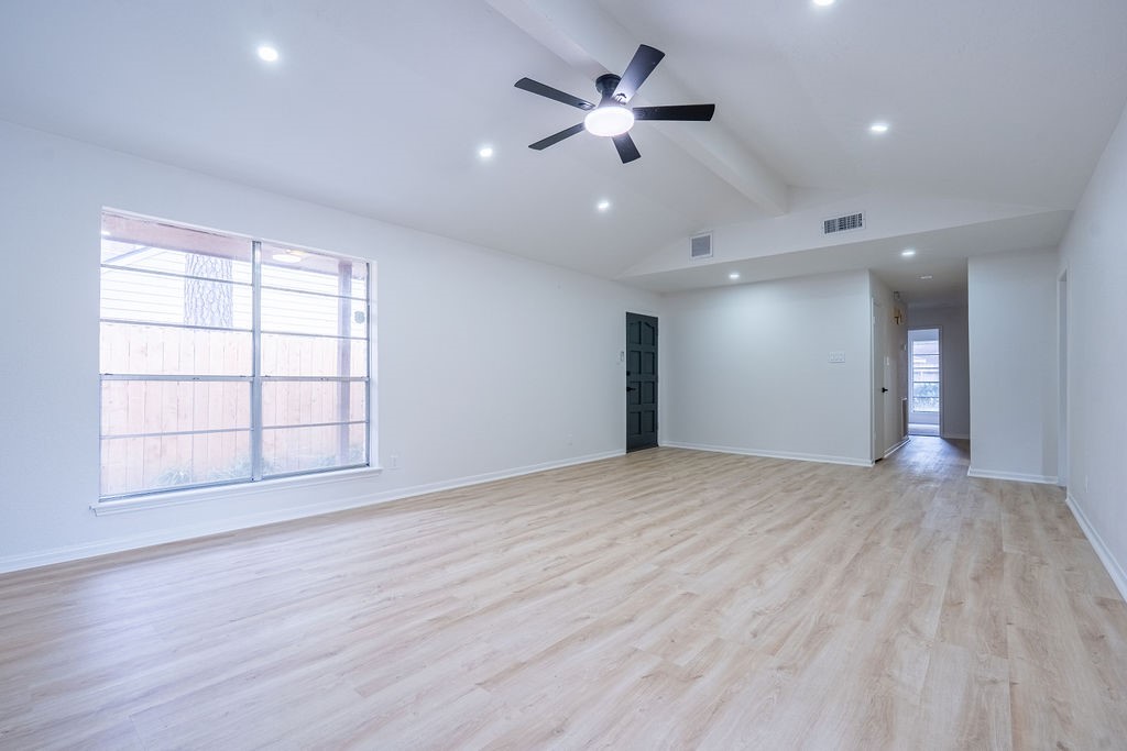 23230 Briarcreek Boulevard Spring, TX 77373 - Photo 11 of 32 a view of an empty room with a window and wooden floor