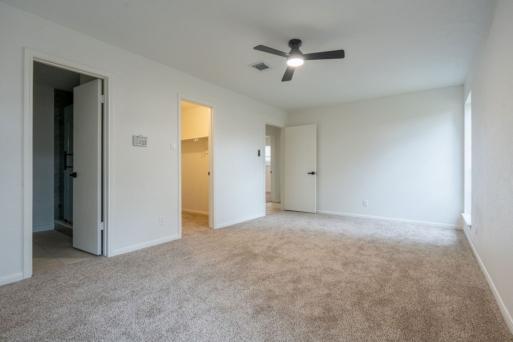 23230 Briarcreek Boulevard Spring, TX 77373 - Photo 14 of 32 an empty room with fan and windows