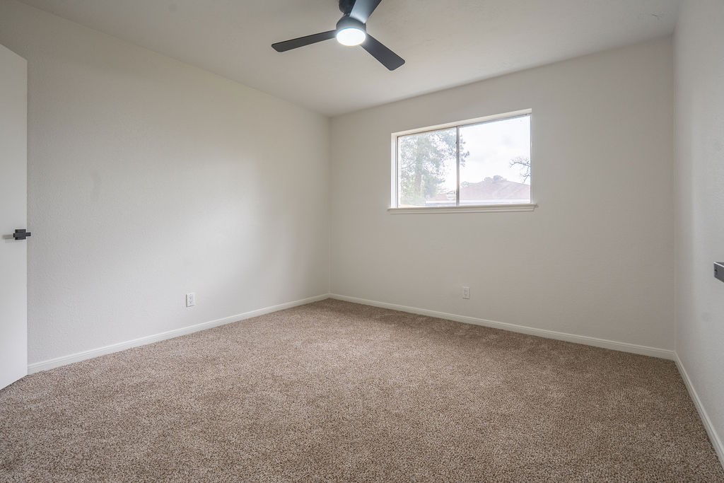 23230 Briarcreek Boulevard Spring, TX 77373 - Photo 16 of 32 an empty room with a window
