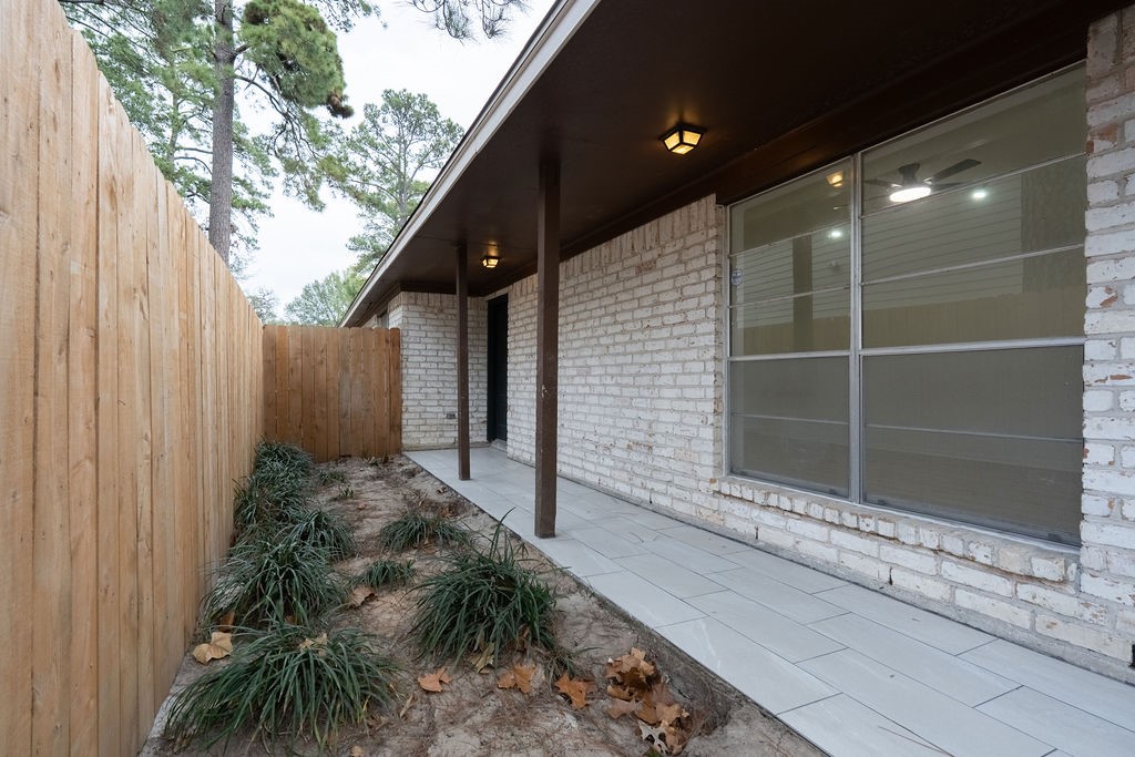 23230 Briarcreek Boulevard Spring, TX 77373 - Photo 25 of 32 a backyard of a house with seating space
