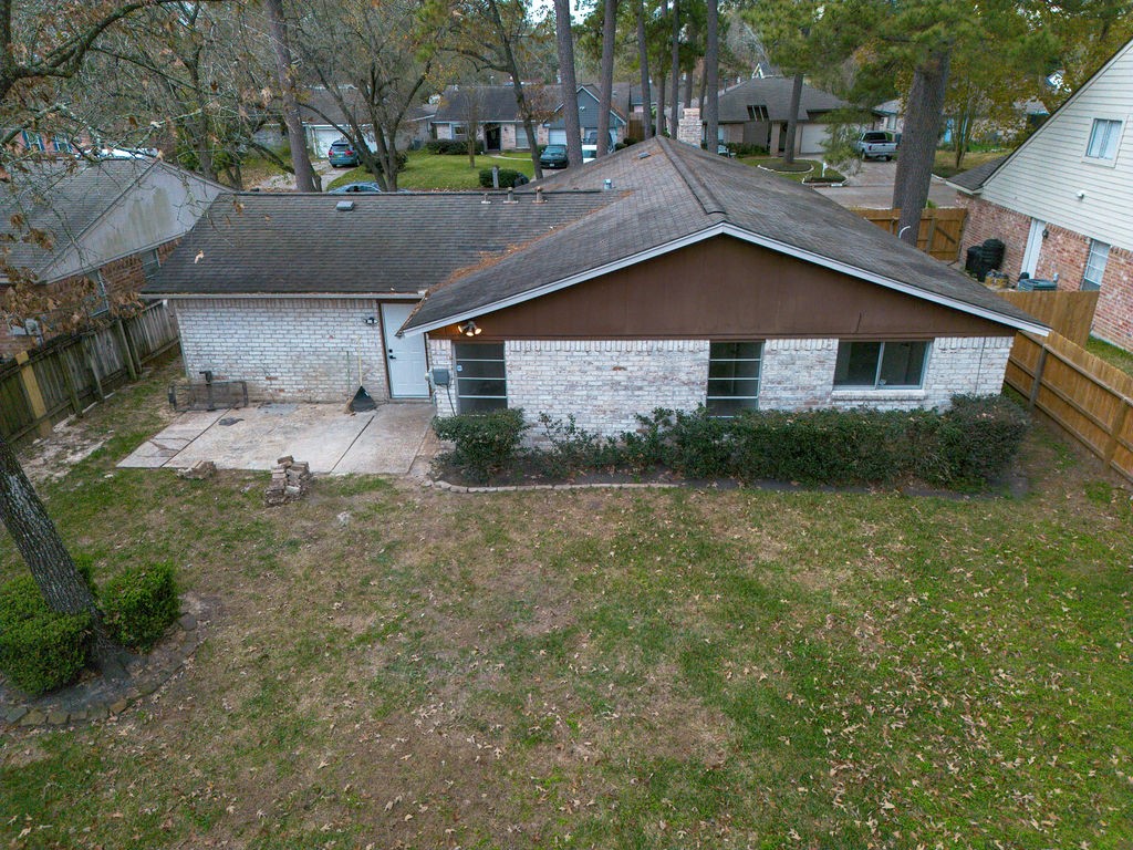 23230 Briarcreek Boulevard Spring, TX 77373 - Photo 31 of 32 a view of a house with a yard and sitting area