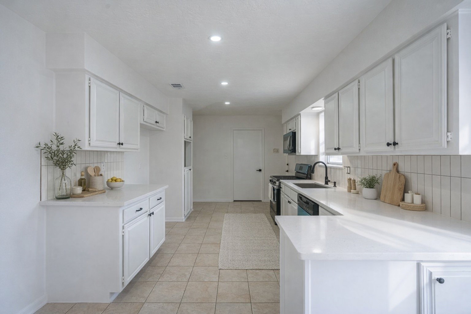 23230 Briarcreek Boulevard Spring, TX 77373 - Photo 4 of 32 a kitchen with stainless steel appliances a sink stove and cabinets