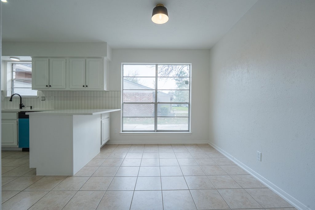 23230 Briarcreek Boulevard Spring, TX 77373 - Photo 9 of 32 a view of a kitchen with a sink cabinets and window