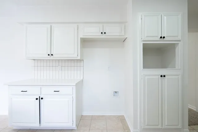 a view of cabinets and window