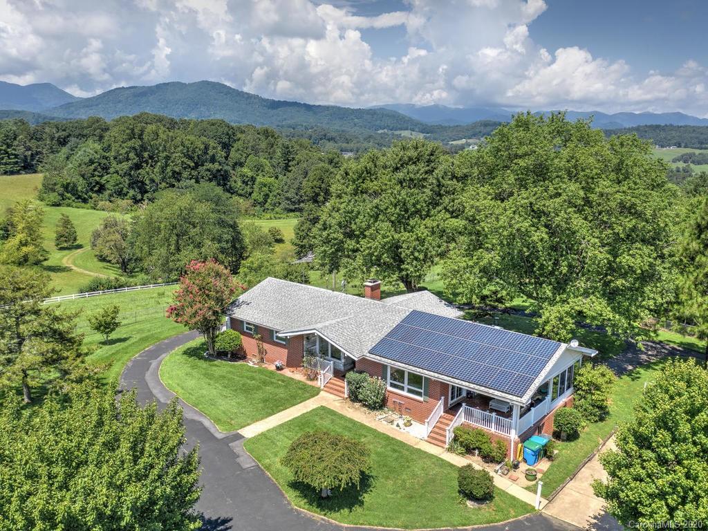 321 Gouges Branch Road Leicester, NC 28748 - Photo 1 of 48 an aerial view of a house with a yard