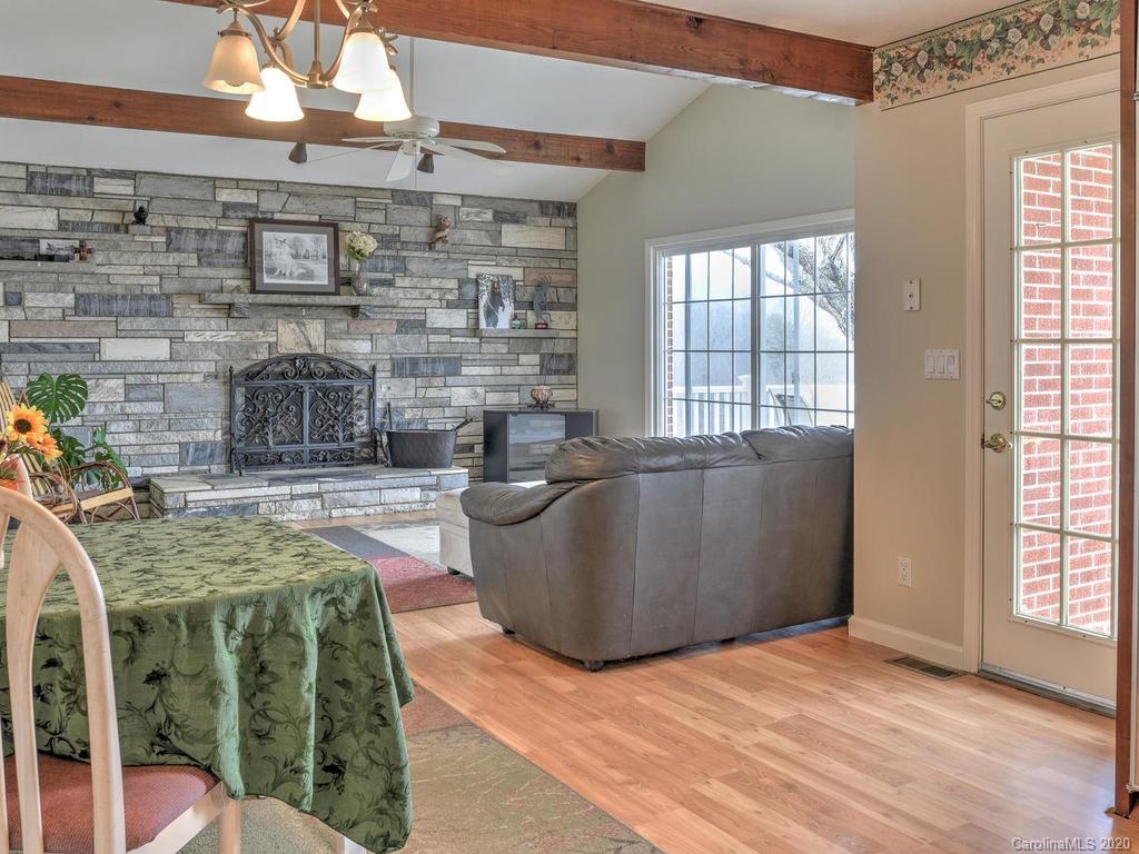 321 Gouges Branch Road Leicester, NC 28748 - Photo 18 of 48 a living room with furniture and a fireplace