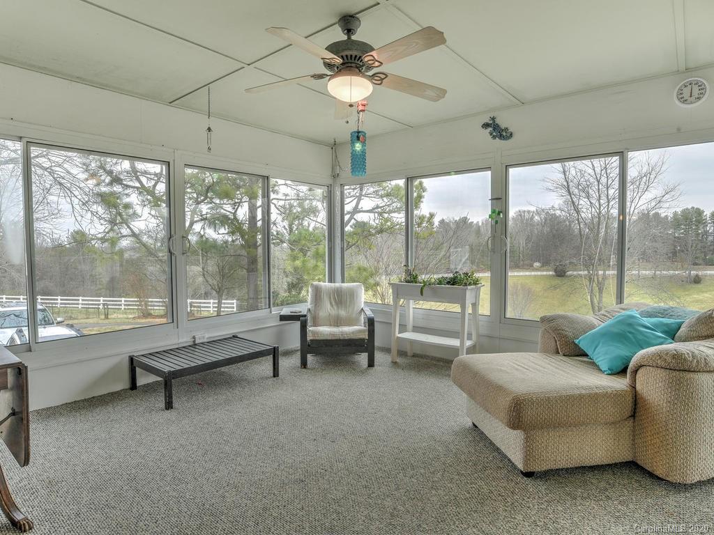 321 Gouges Branch Road Leicester, NC 28748 - Photo 20 of 48 a living room with furniture and a large window