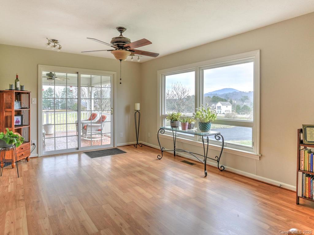 321 Gouges Branch Road Leicester, NC 28748 - Photo 22 of 48 a view of a livingroom with wooden floor and a furniture