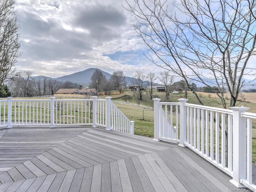 321 Gouges Branch Road Leicester, NC 28748 - Photo 25 of 48 a balcony with trees in front of it