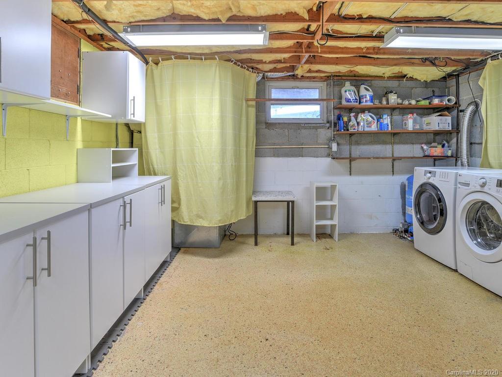 321 Gouges Branch Road Leicester, NC 28748 - Photo 32 of 48 a view of a storage & utility room with washer and dryer