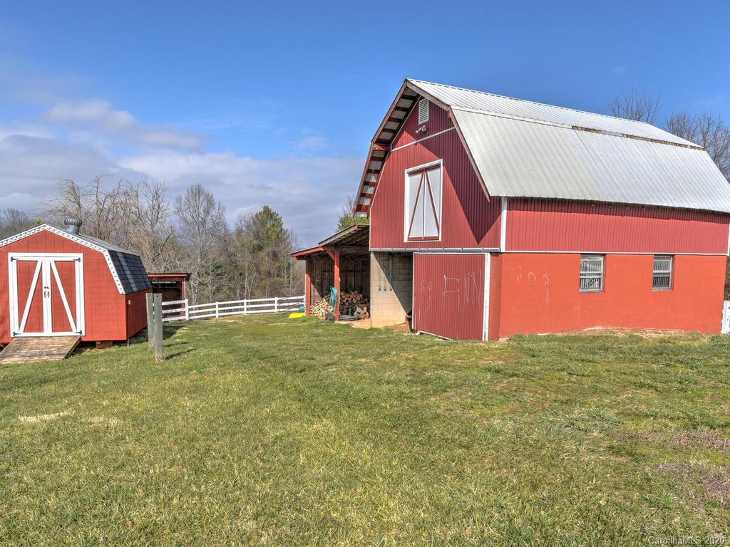 321 Gouges Branch Road Leicester, NC 28748 - Photo 35 of 48 a view of a house with a yard