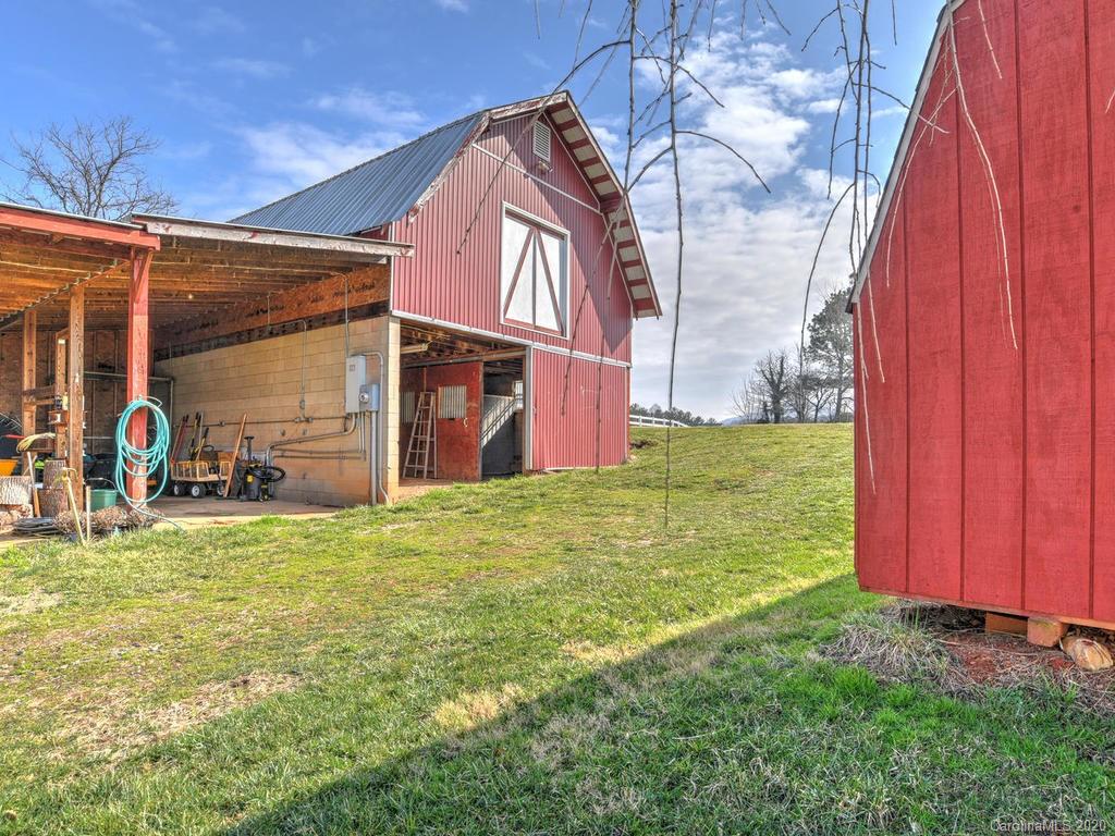 321 Gouges Branch Road Leicester, NC 28748 - Photo 37 of 48 a backyard of a house with yard and outdoor seating