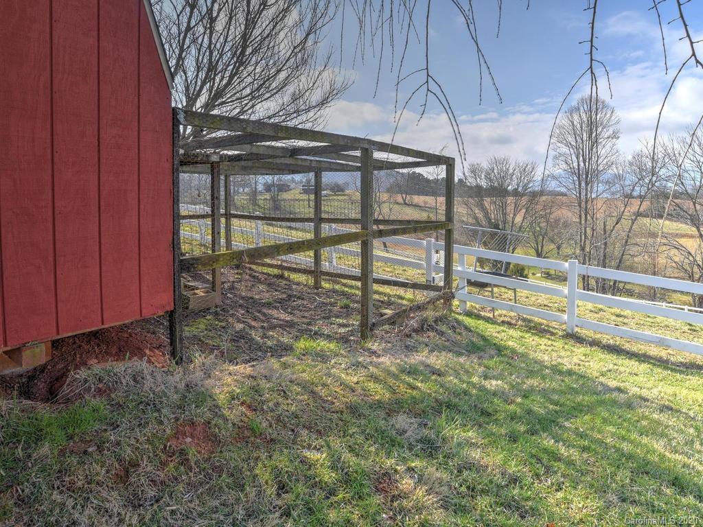 321 Gouges Branch Road Leicester, NC 28748 - Photo 38 of 48 a view of a backyard with a table and chairs