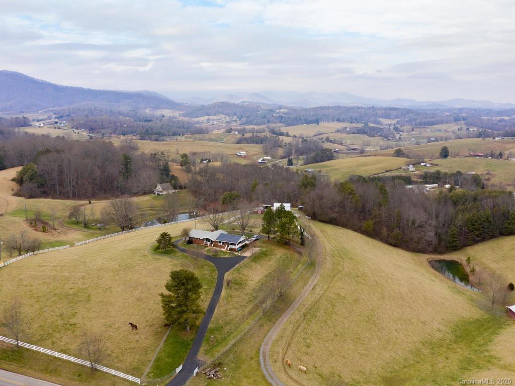 321 Gouges Branch Road Leicester, NC 28748 - Photo 45 of 48 a view of a swimming pool with mountain and lake view