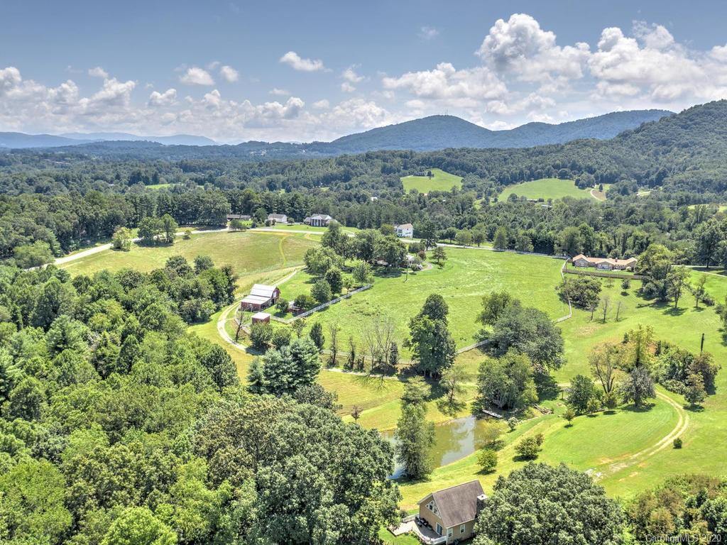 321 Gouges Branch Road Leicester, NC 28748 - Photo 9 of 48 a view of a city with lush green forest