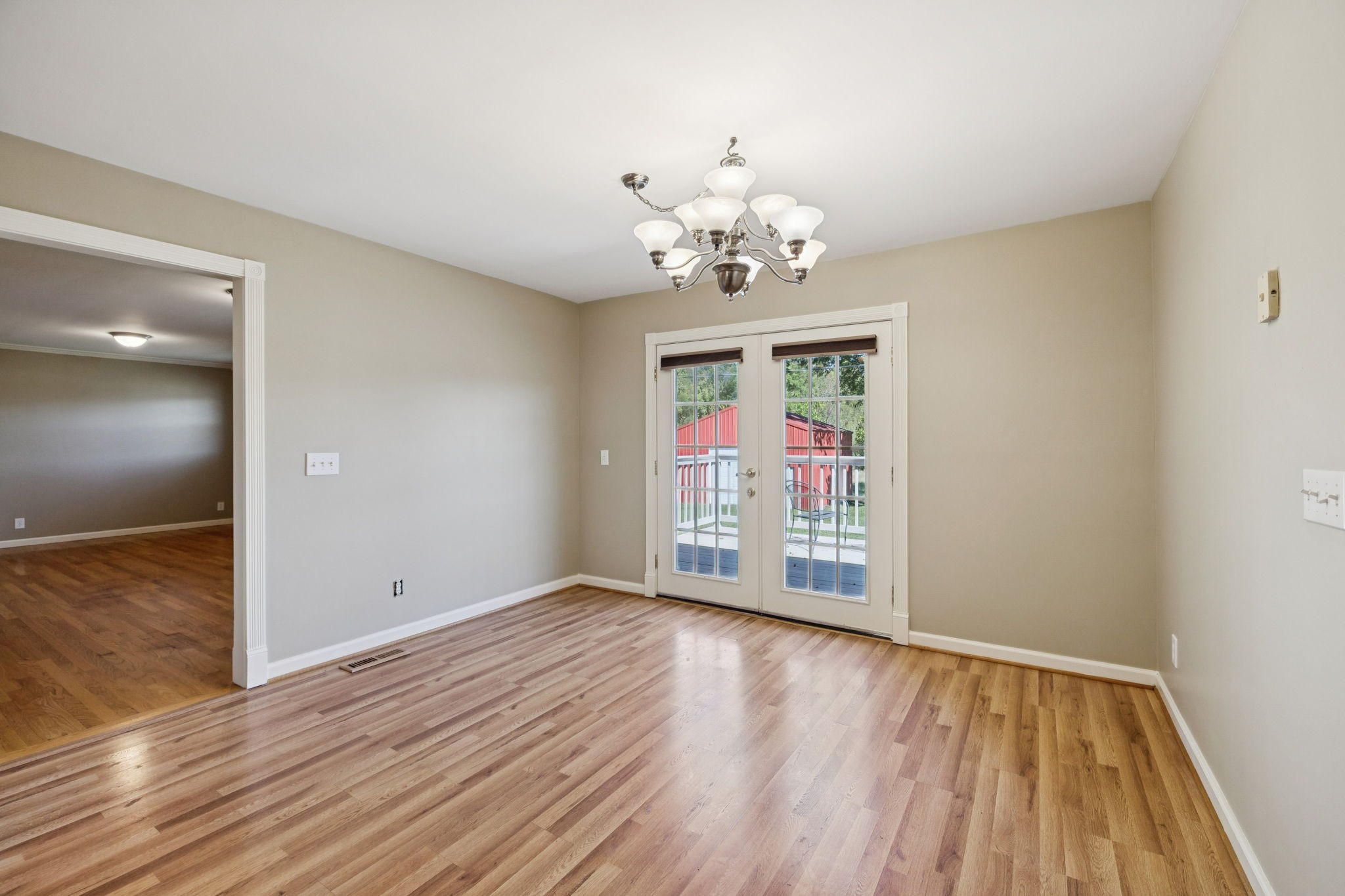 10446 Bold Springs Road McEwen, TN 37101 - Photo 12 of 54 a view of an empty room with wooden floor and a window