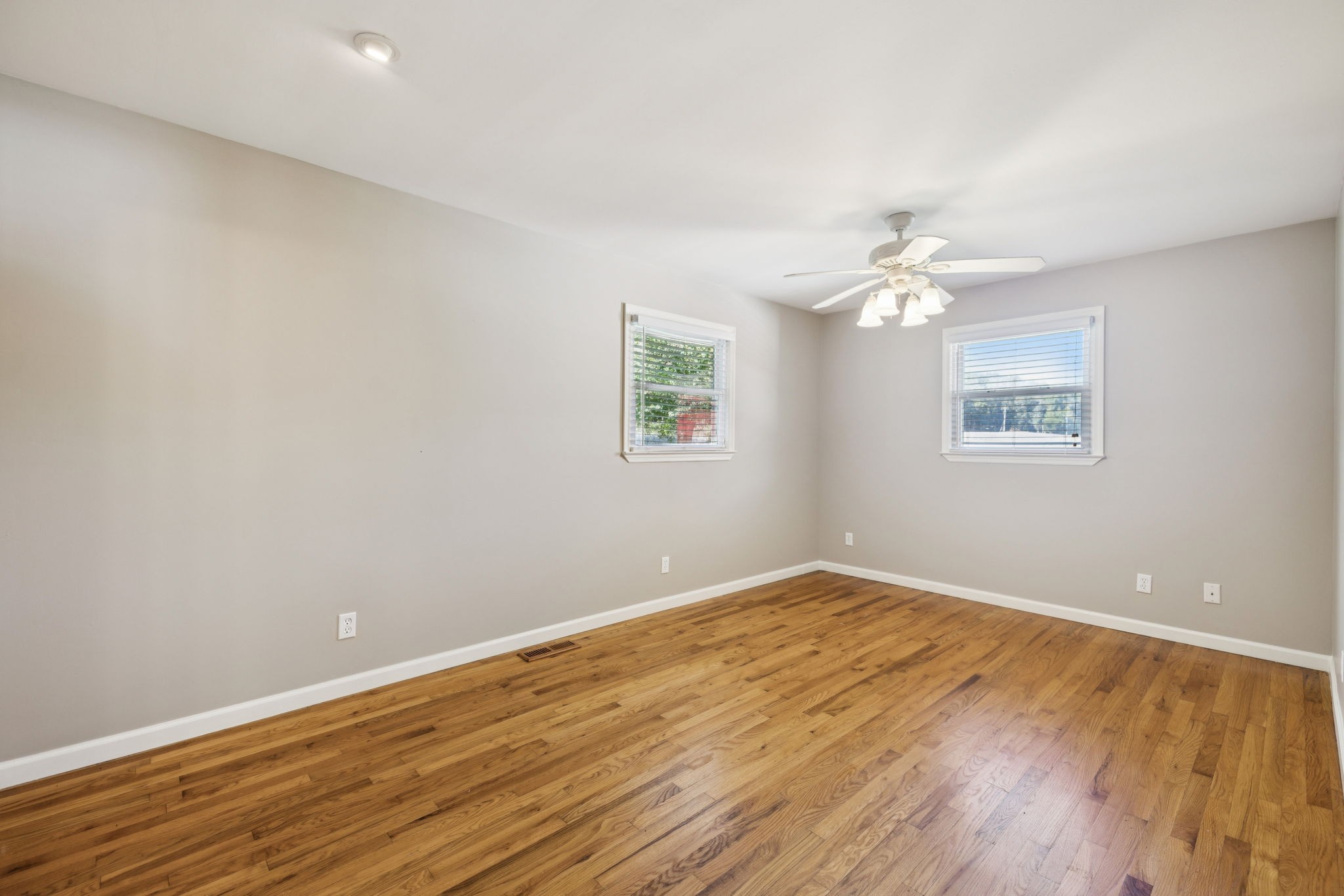 10446 Bold Springs Road McEwen, TN 37101 - Photo 19 of 54 a view of an empty room with wooden floor and a window