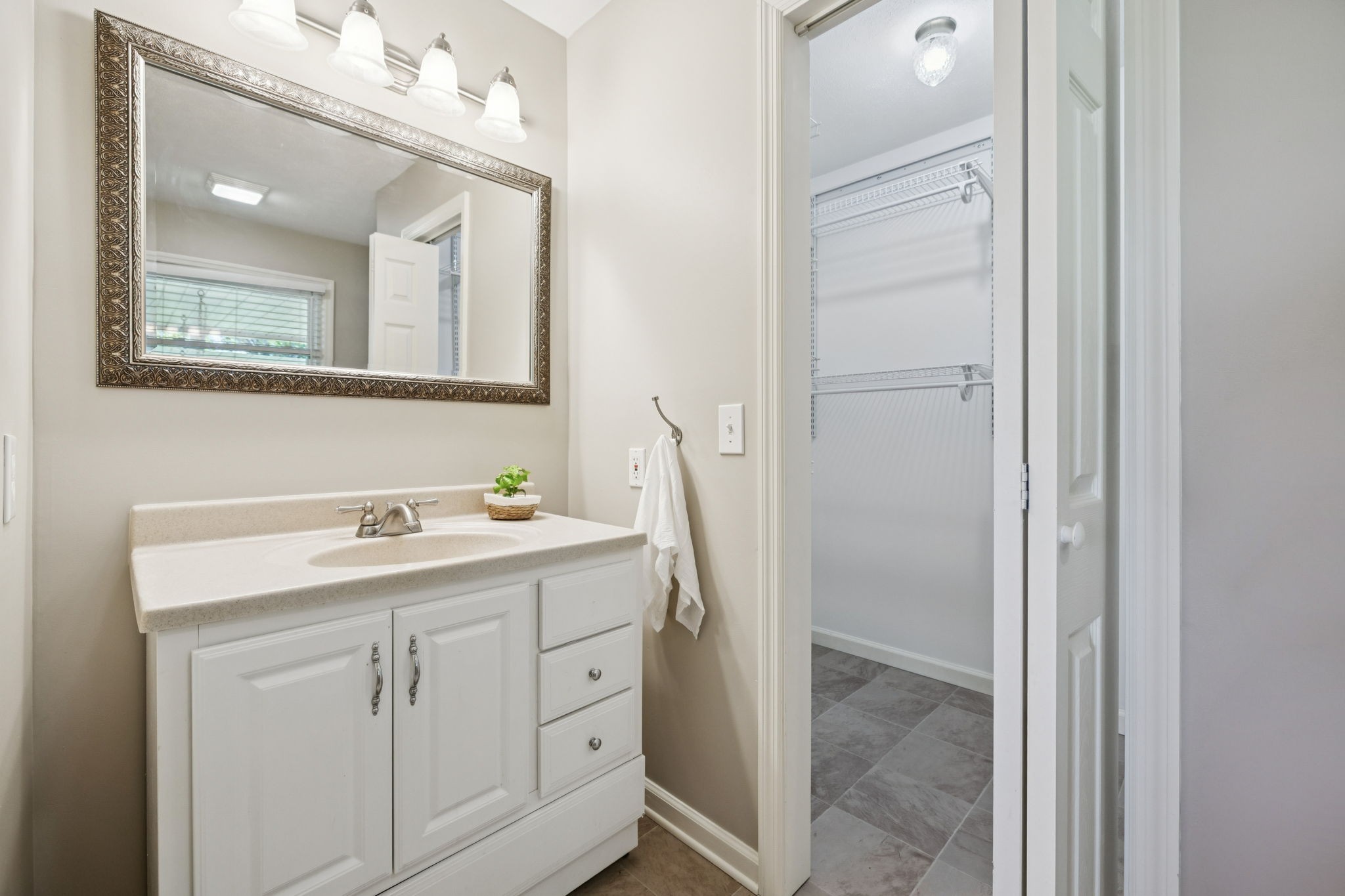 10446 Bold Springs Road McEwen, TN 37101 - Photo 21 of 54 a bathroom with a sink vanity and mirror